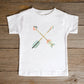 White toddler size t-shirt with teal blue and dusty pink pastel criss-cross boho arrows, one with a heart on the end, matching mommy-and-me Christian Mom "Raising Arrows" Psalm 127:4-5 bible verse t-shirt for boys and girls