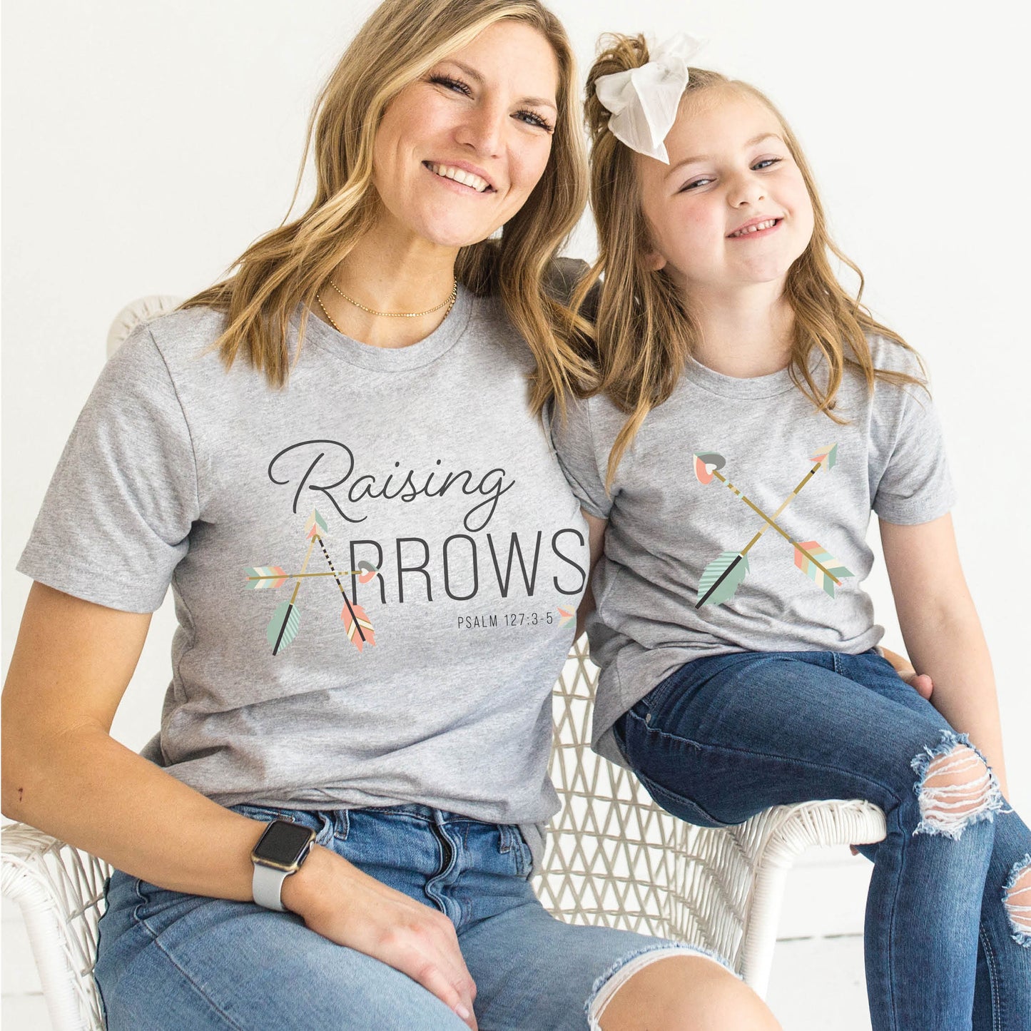 Heather gray and pastel boho arrow Christian aesthetic faith-based t-shirt and matching mommy-and-me youth toddler tee with Psalm 127:3-5 bible verse quote that says "Raising Arrows" blessed is the one with a quiver full of children, perfect for homeschool moms and kids