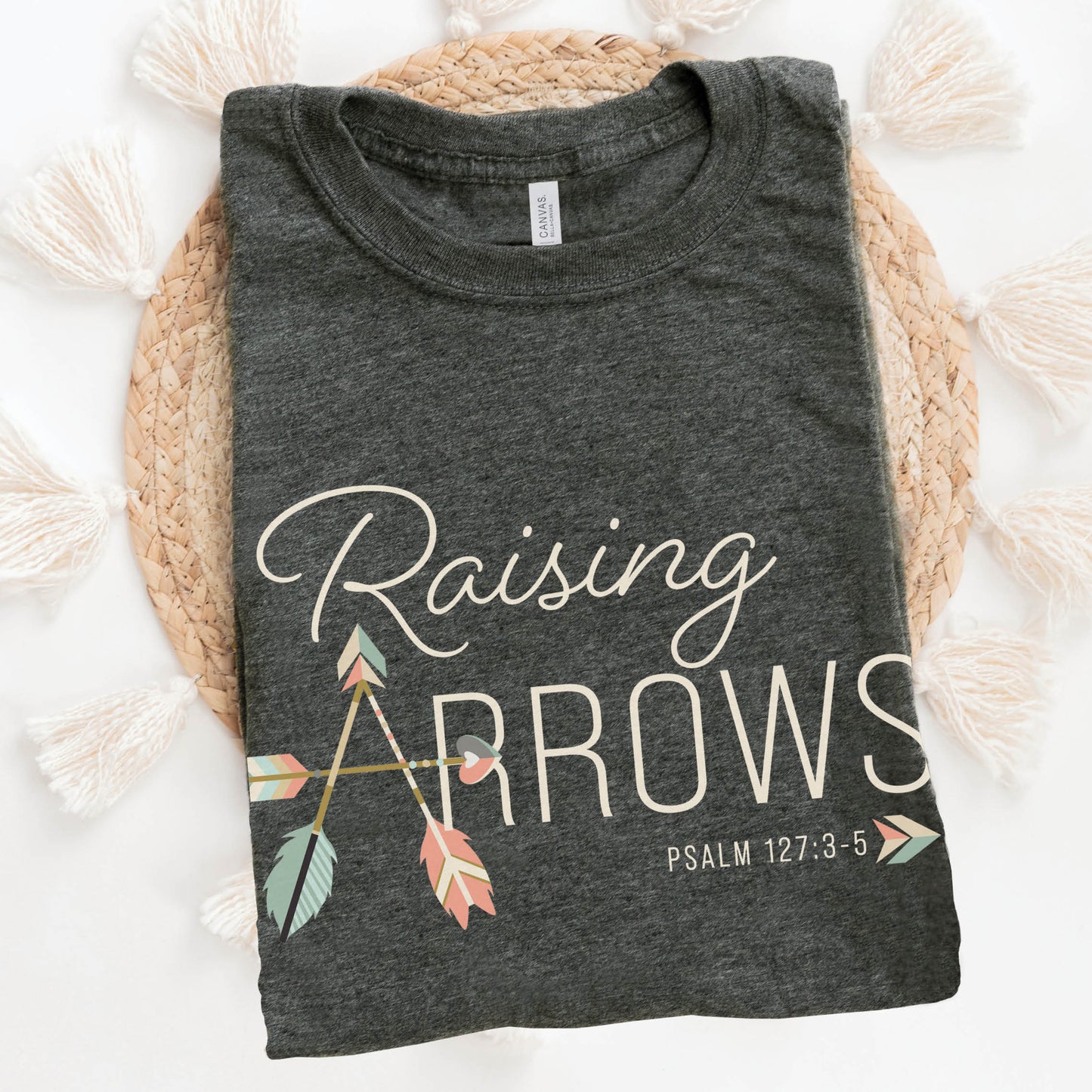 Heather dark gray and pastel boho arrow Christian aesthetic faith-based t-shirt with Psalm 127:3-5 bible verse quote that says "Raising Arrows" blessed is the one with a quiver full of children, perfect for homeschool moms and kids