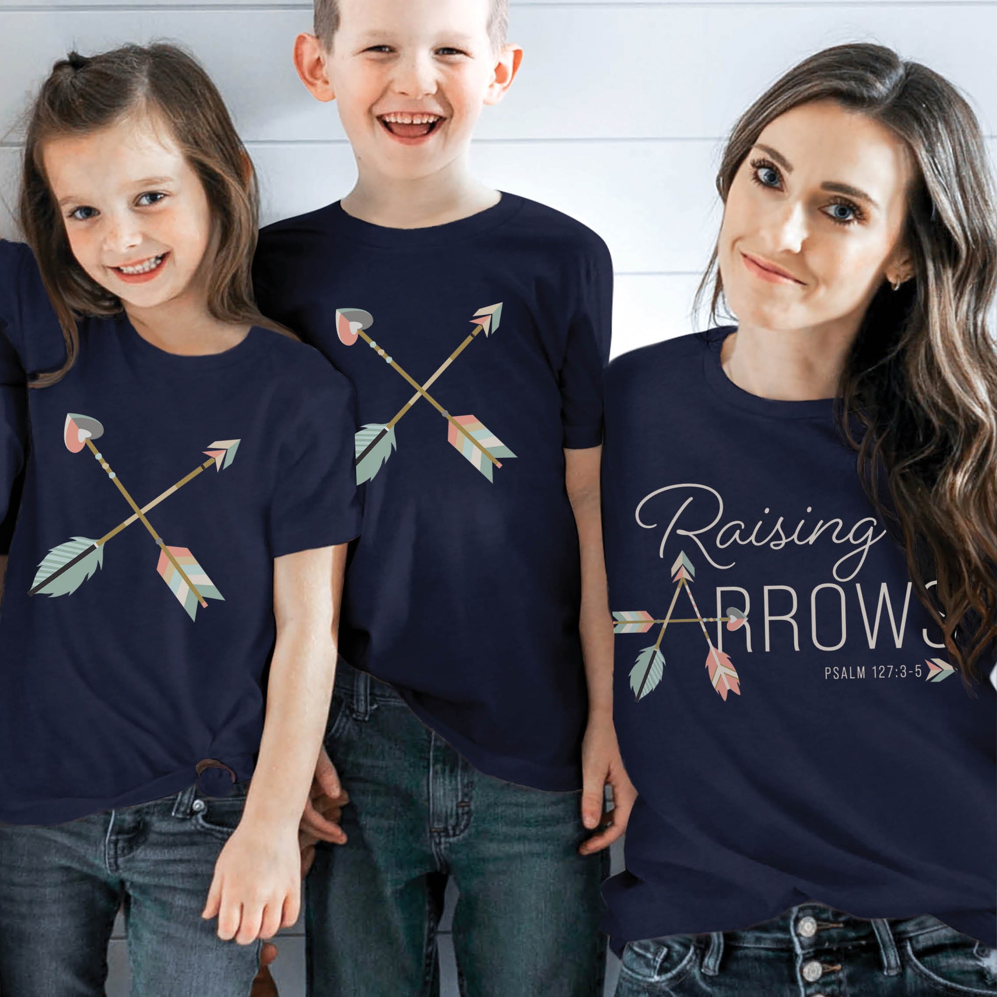 Navy Blue and pastel boho arrow Christian aesthetic faith-based t-shirt and matching mommy-and-me youth & toddler boys and girls tee with Psalm 127:3-5 bible verse quote that says "Raising Arrows" blessed is the one with a quiver full of children, perfect for homeschool moms and kids