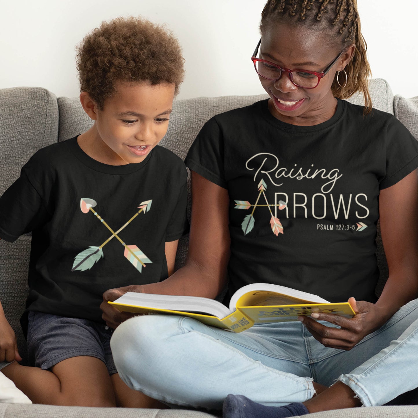 Black pastel boho arrow Christian aesthetic faith-based t-shirt and matching mommy-and-me youth toddler tee with Psalm 127:3-5 bible verse quote that says "Raising Arrows" blessed is the one with a quiver full of children, perfect for homeschool moms and kids