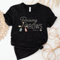 Black and pastel boho arrow Christian aesthetic faith-based t-shirt with Psalm 127:3-5 bible verse quote that says "Raising Arrows" blessed is the one with a quiver full of children, perfect for homeschool moms and kids