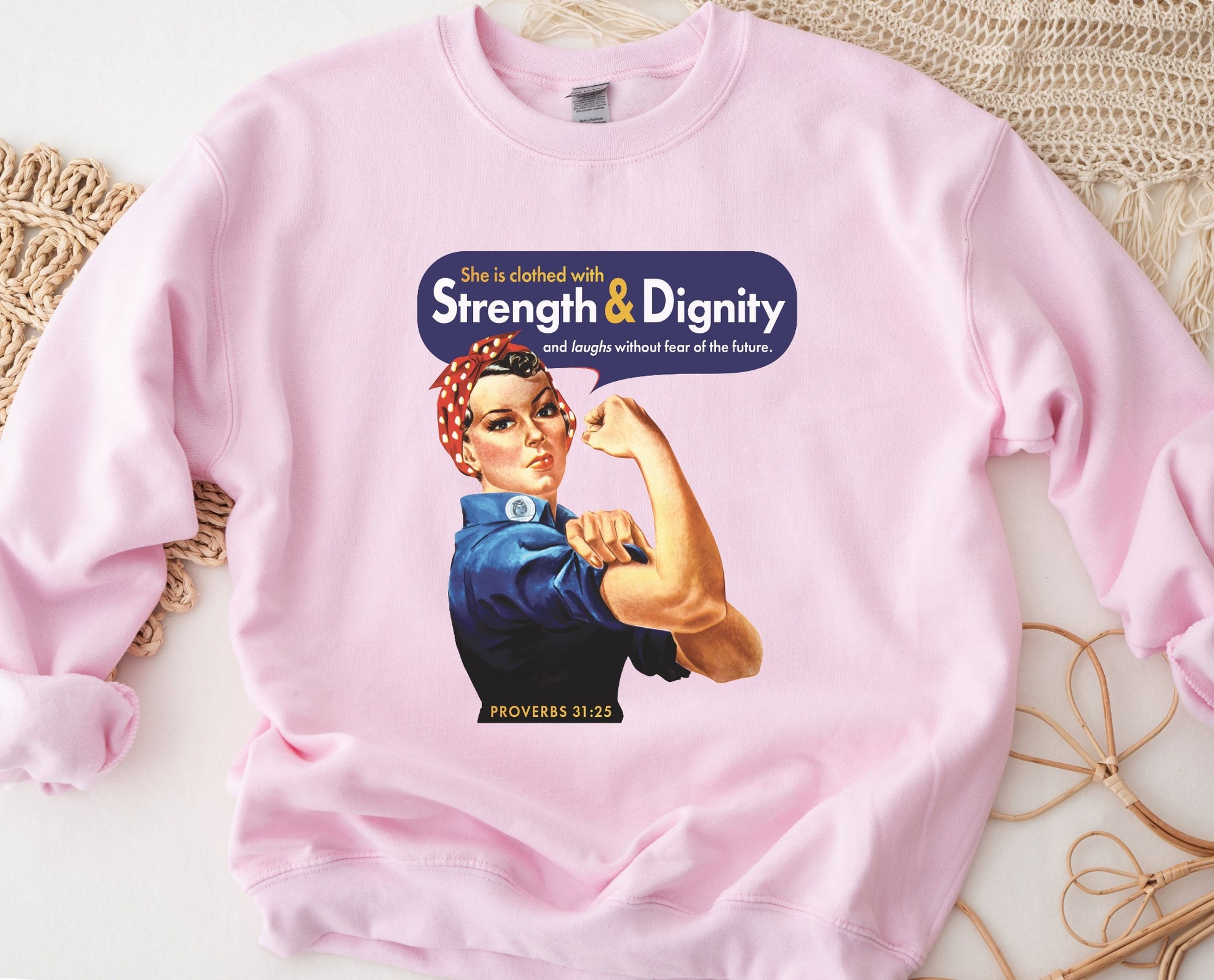Rosie the Riveter Proverbs 31 Woman Christian aesthetic with iconic vintage female muscle design printed in red gold and navy blue on cozy light pink unisex crewneck sweatshirt for women