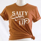 Salty And Lit Matthew 5:13-14 bible verse funny Christian T-Shirt design printed in white on soft toast rust tee for women