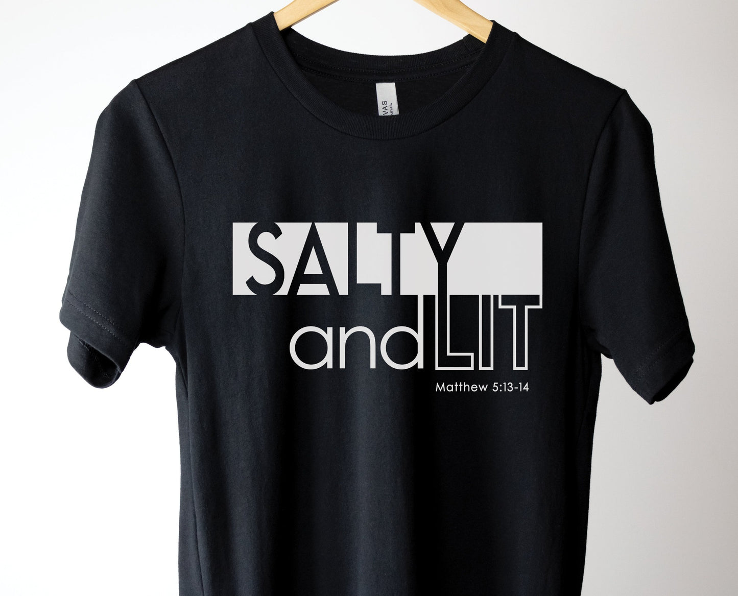 Funny Christian Salty And Lit Matthew 5:13-14 bible verse printed on soft unisex black t-shirt for Men