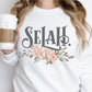 Selah Psalm watercolor floral Christian aesthetic design printed in charcoal gray, peach, blush pink, on cozy white unisex crewneck sweatshirt for women
