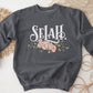Selah Psalm watercolor floral Christian aesthetic design printed in white, peach, blush pink, and sage green on cozy heather dark gray unisex crewneck sweatshirt for women