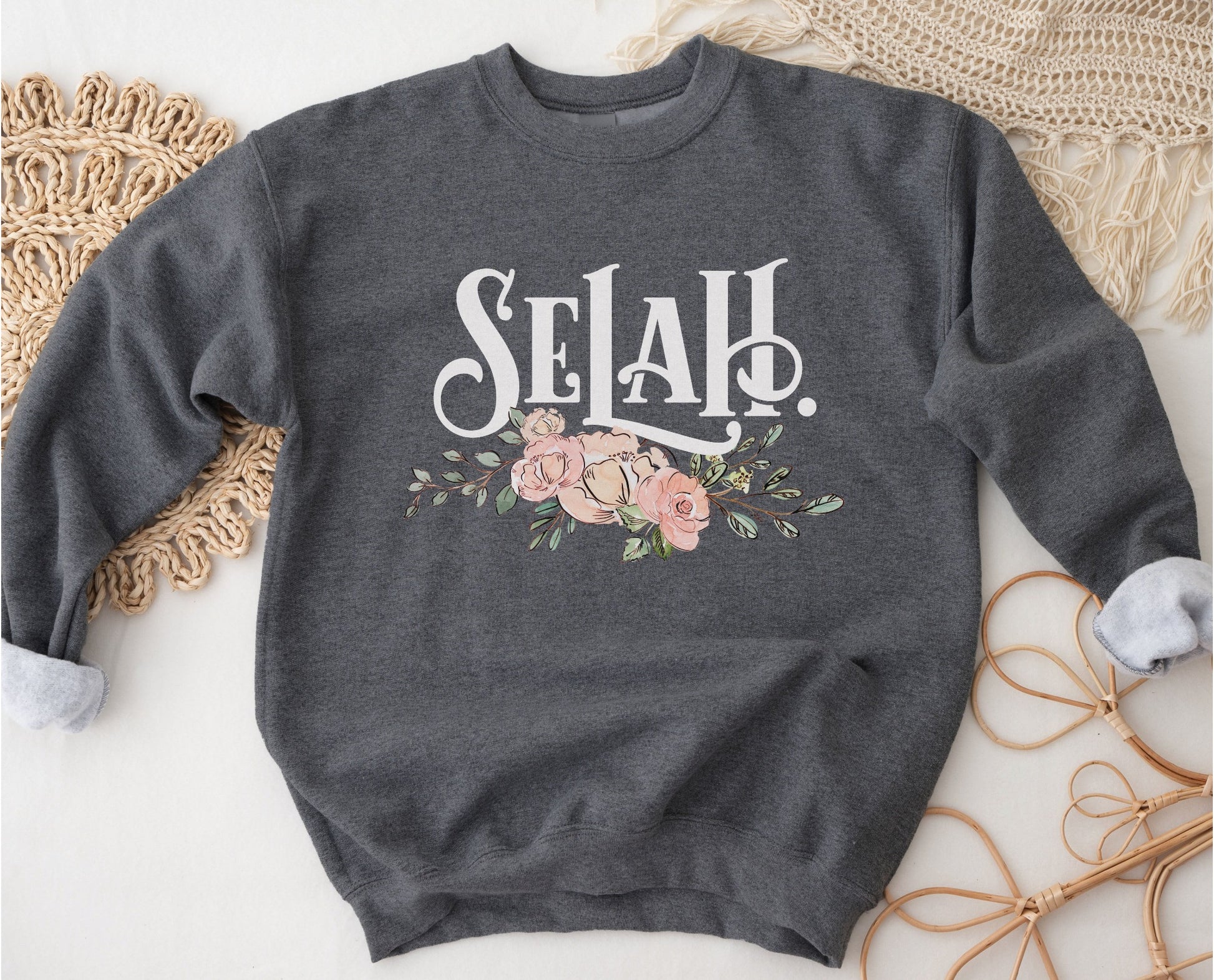 Selah Psalm watercolor floral Christian aesthetic design printed in white, peach, blush pink, and sage green on cozy heather dark gray unisex crewneck sweatshirt for women