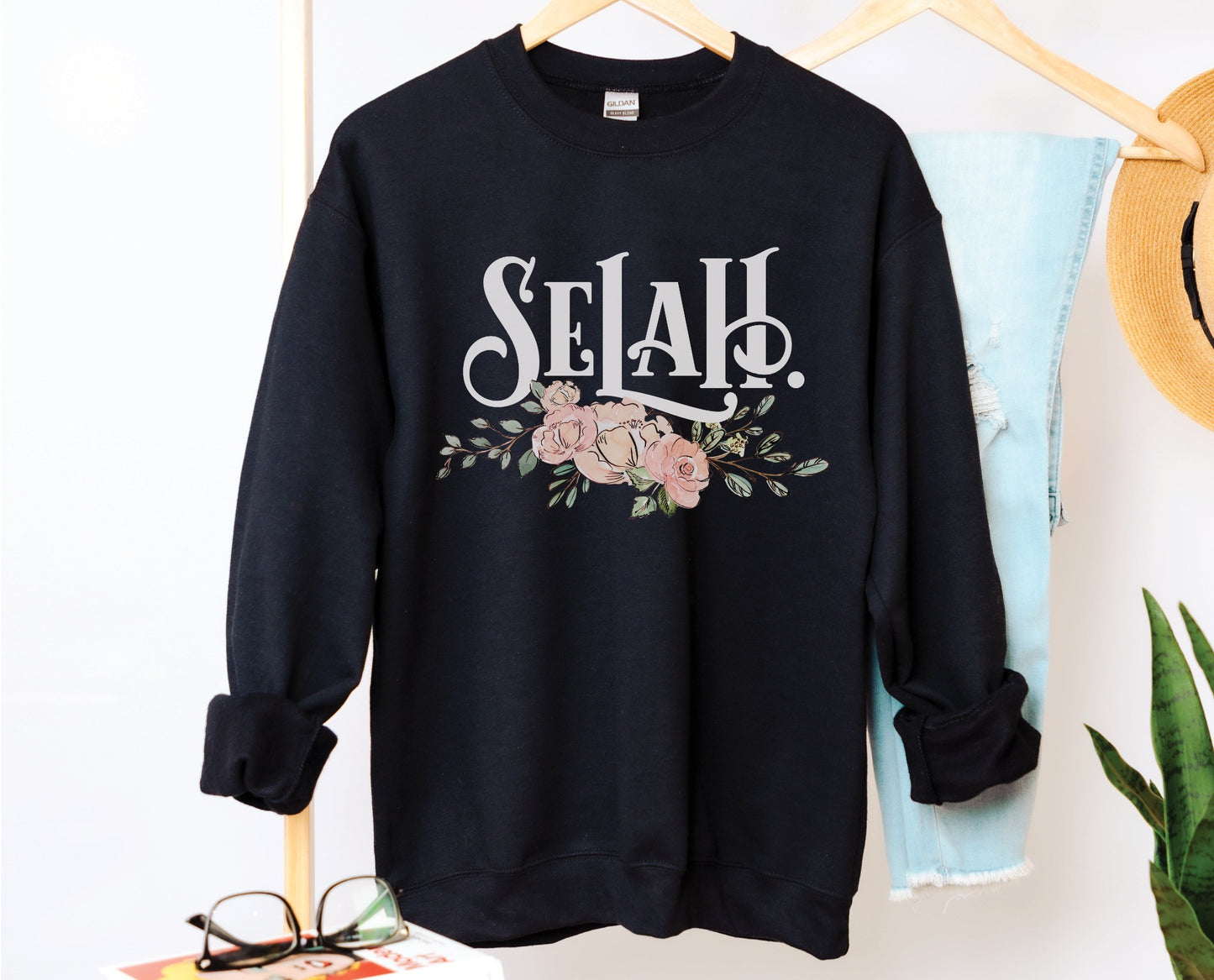 Selah Psalm watercolor floral Christian aesthetic design printed in white, peach, blush pink, and sage green on cozy black unisex crewneck sweatshirt for women