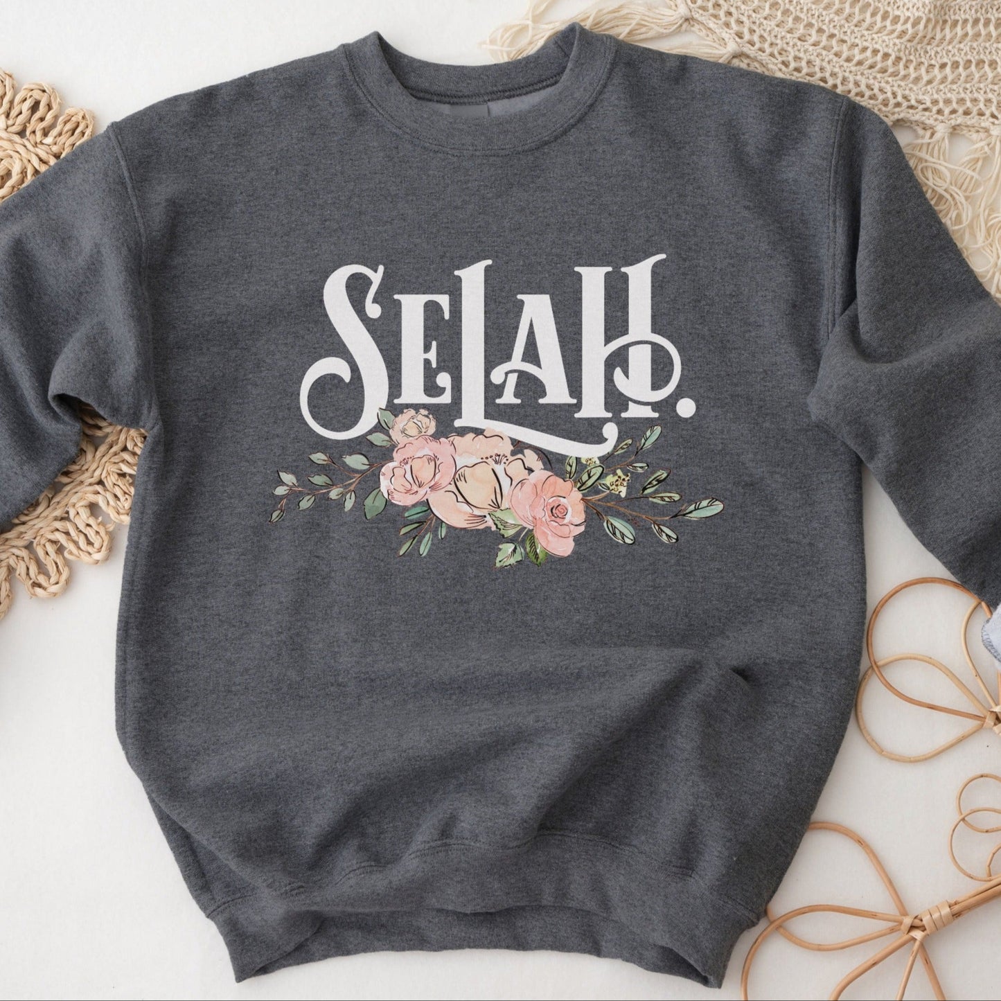 Selah Psalm watercolor floral Christian aesthetic design printed in white, peach, blush pink, and sage green on cozy heather dark gray unisex crewneck sweatshirt for women