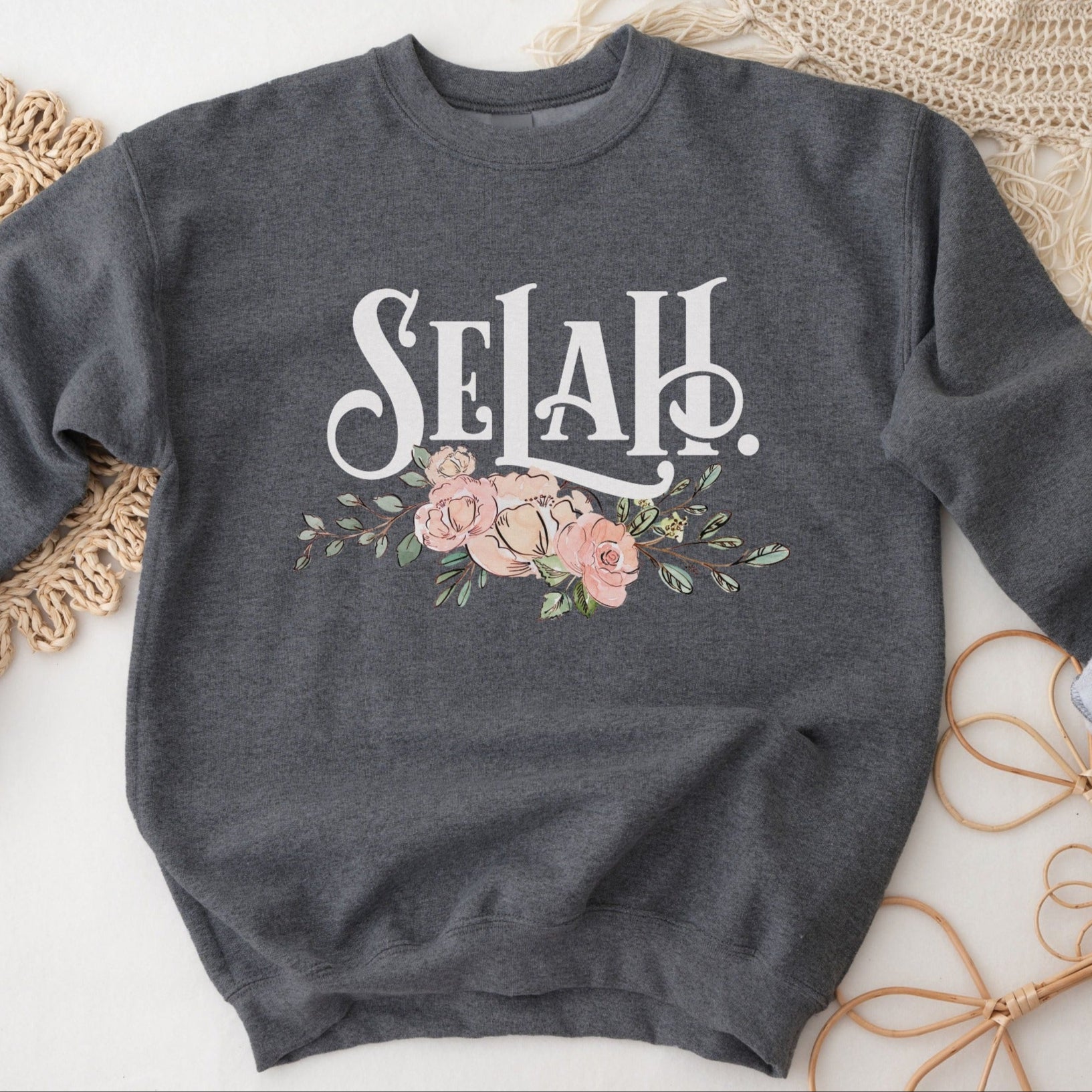 Selah Psalm watercolor floral Christian aesthetic design printed in white, peach, blush pink, and sage green on cozy heather dark gray unisex crewneck sweatshirt for women