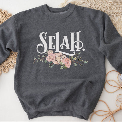 Selah Psalm watercolor floral Christian aesthetic design printed in white, peach, blush pink, and sage green on cozy heather dark gray unisex crewneck sweatshirt for women