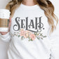 Selah Psalm watercolor floral Christian aesthetic design printed in charcoal gray, peach, blush pink, on cozy white unisex crewneck sweatshirt for women