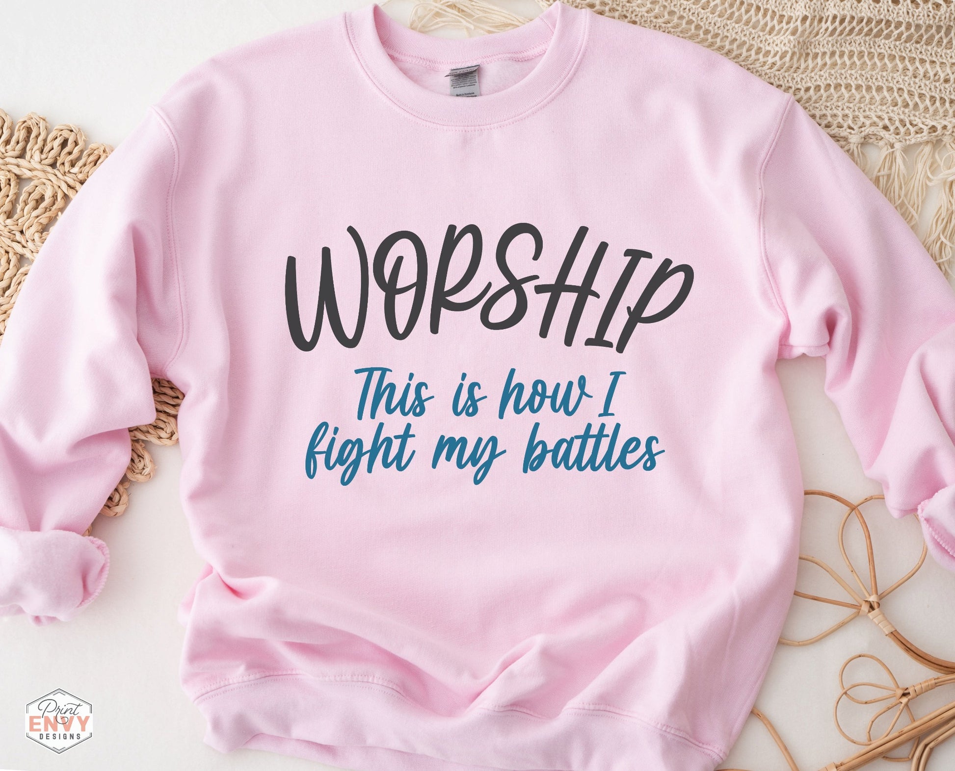 Worship This Is How I Fight My Battles Christian aesthetic unisex crewneck sweatshirt design printed in charcoal and teal on cozy light pink sweater for women, great gift for worship leaders