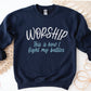 Worship This Is How I Fight My Battles Christian aesthetic unisex crewneck sweatshirt design printed in white and teal on cozy navy blue sweater for women, great gift for worship leaders