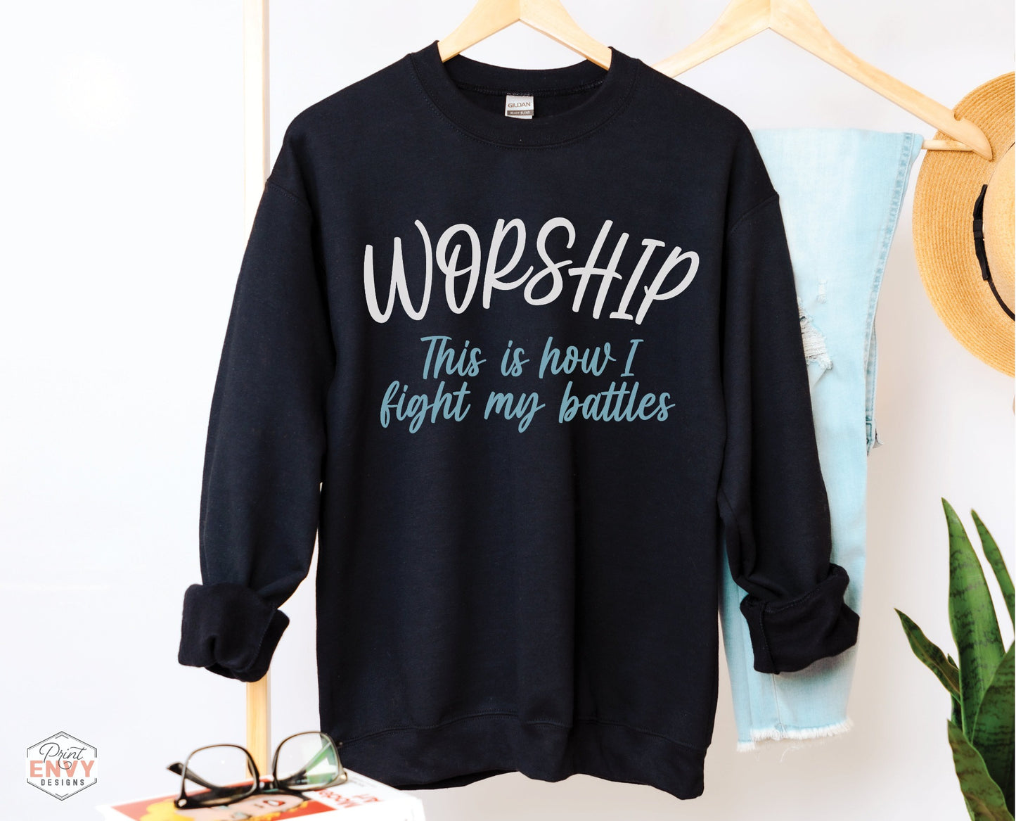 Worship This Is How I Fight My Battles Christian aesthetic unisex crewneck sweatshirt design printed in white and teal on cozy black sweater for women, great gift for worship leaders