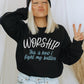 Worship This Is How I Fight My Battles Christian aesthetic unisex crewneck sweatshirt design printed in white and teal on cozy black sweater for women, great gift for worship leaders