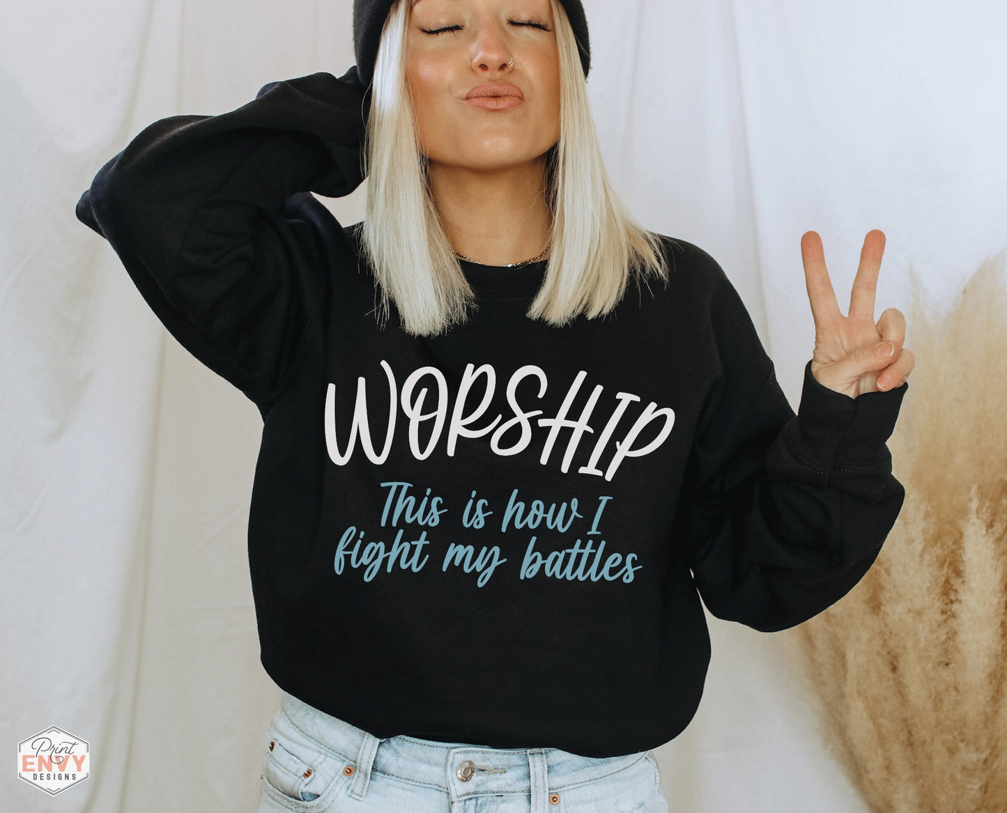 Worship This Is How I Fight My Battles Christian aesthetic unisex crewneck sweatshirt design printed in white and teal on cozy black sweater for women, great gift for worship leaders