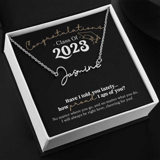 Personalized stainless steel silver Name Necklace Graduation Gift for Her with black background message card that says "Congratulations Class of 2023 - have I told you lately how proud I am of you? in white and gold with grad cap line drawing in jewelry gift box