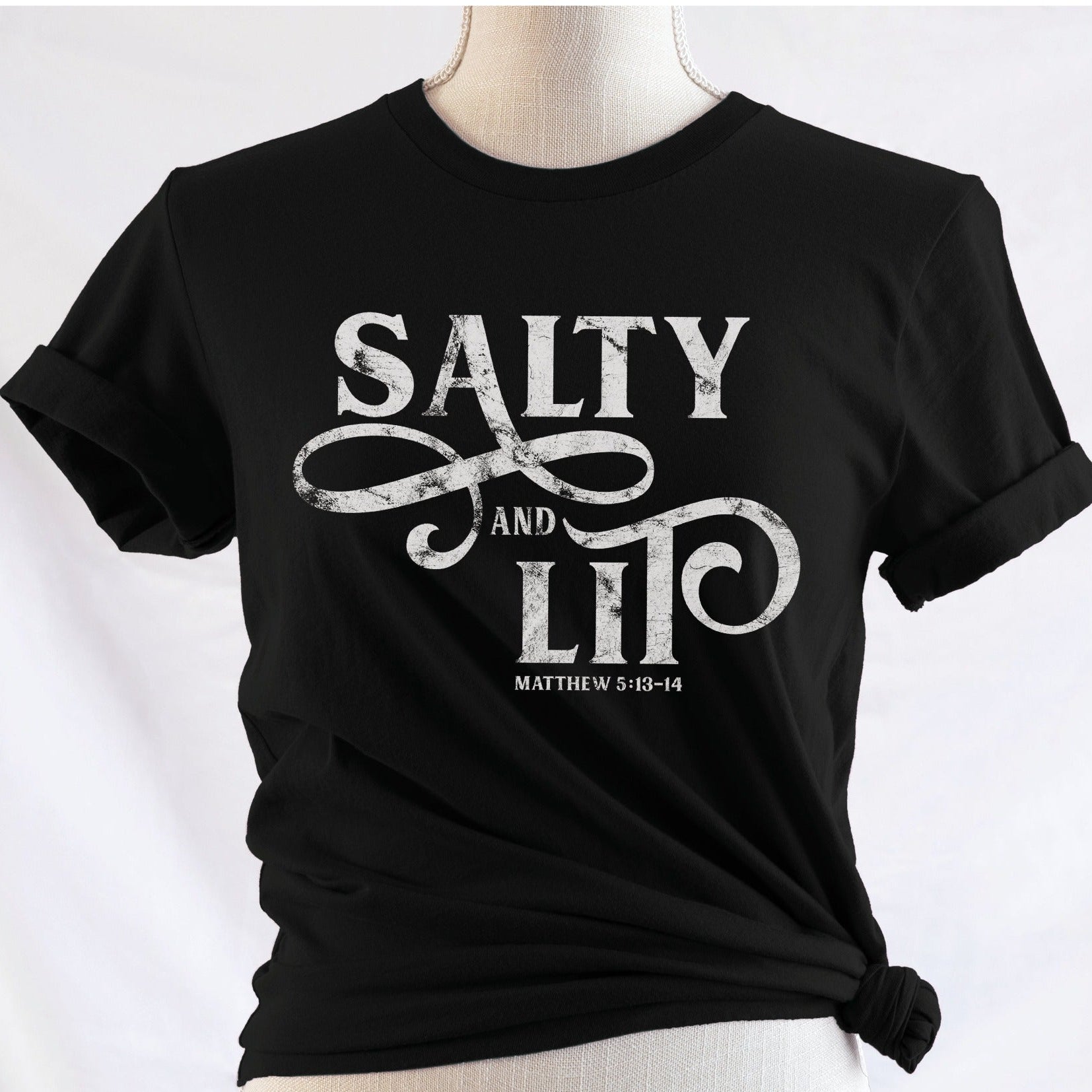 Salty And Lit Matthew 5:13-14 bible verse funny Christian T-Shirt design printed in white on soft black tee for women