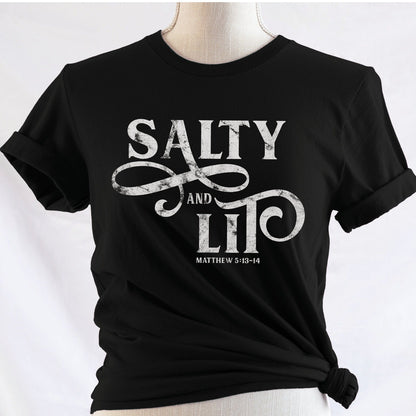 Salty And Lit Matthew 5:13-14 bible verse funny Christian T-Shirt design printed in white on soft black tee for women