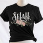 Selah Psalm bible verse watercolor floral Christian aesthetic design printed in white peach blush pink on soft black t-shirt for women