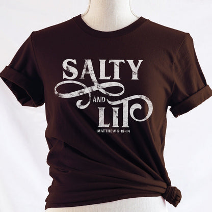 Salty And Lit Matthew 5:13-14 bible verse funny Christian T-Shirt design printed in white on soft mocha brown tee for women
